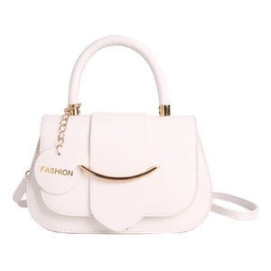 White trapezoid underarm bag with gold metal trim and detachable shoulder strap