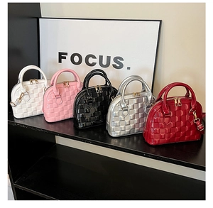 Close-up of stylish shell bags featuring woven lattice patterns in five vibrant colors