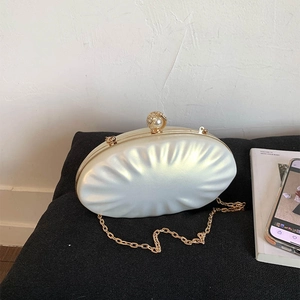 Elegant pearl white shell bag with pleated texture, luxury pearl clasp and gold chain