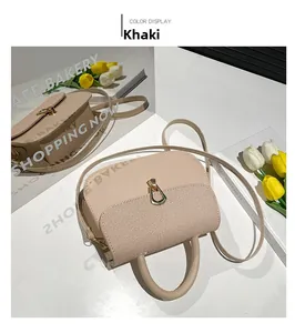 Detailed view of khaki saddle bag with woven texture and golden horseshoe buckle