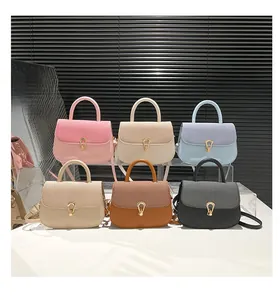Detailed view of six colorful crossbody bags with woven flaps and U-shaped gold locks