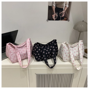 Three shoulder bags in pink black and white with 3D bow texture and wide straps