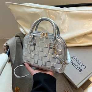 Silver embossed shell handbag with gold hardware and square textured faux leather finish