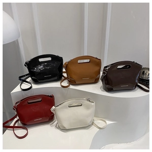 Group display of high-shine patent leather tote bags in five classic vintage colors