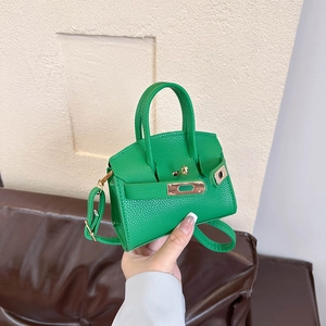 Bright green lychee grain leather Kelly bag with metal lock and adjustable shoulder strap