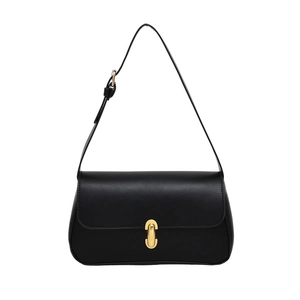 Minimalist black underarm bag with gold U-shaped buckle and adjustable shoulder strap
