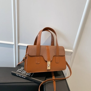 Braune Handtasche aus Leder und Stoff mit goldenem Schloss und abnehmbarem Schultergurt