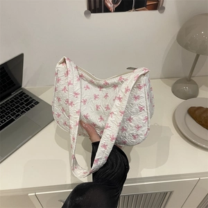 Minimalist white shoulder bag with pink bow pattern and bubble texture for women