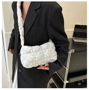 White quilted puffer shoulder bag with a minimalist puffy cloud-like design