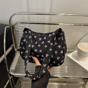 Chic black crinkle fabric underarm bag with pink bow print and silver zipper