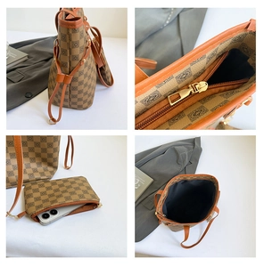 Detail view of large brown geometric tote bag with matching zippered pouch and metal hardware