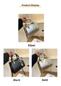 Three minimalist crossbody bags in silver, black, and gold with pearl bow charms