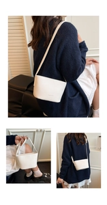 Close-up of white lychee grain bucket bag with FASHION embossed detail and thin strap