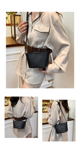 Detailed views of a black lychee texture bucket bag with FASHION embossed detail