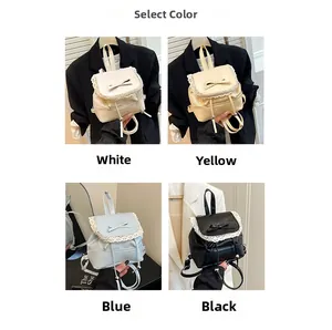 Lace trim mini backpacks in white, yellow, blue and black with ribbon bow detail