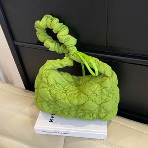 Bright green quilted cloud bag with ruched texture and elastic top handle for summer