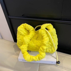 Quilted yellow puffy cloud shoulder bag with textured pleats and crossbody strap