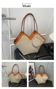 Detail view of khaki monogram tote bag with matching round coin purse and brown leather trim