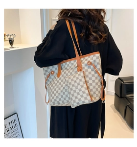 Detailed view of retro printed tote bag with a matching small pouch on a model