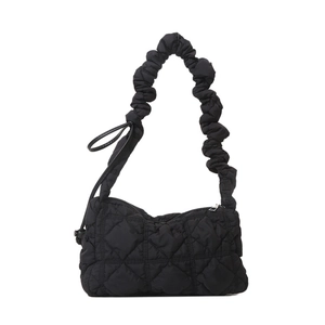 Quilted black nylon cloud bag with ruched scrunchie shoulder strap and puffy texture