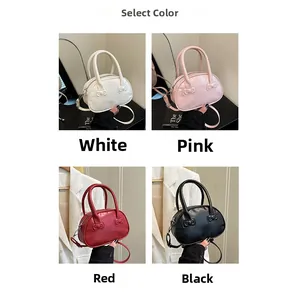 Close-up of mini bowling bags in white, pink, red, and black with bow relief details
