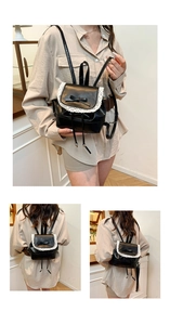 Detail of a mini black leather backpack with white lace edges and a sweet bow decoration