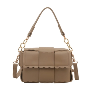 Brown woven crossbody bag with wavy trim and adjustable gold chain strap on white background