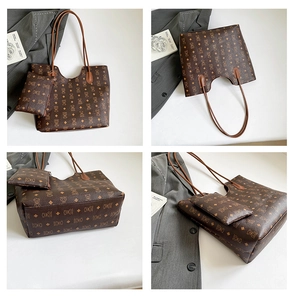 Detail view of large brown vintage tote bag set with teddy bear monogram pattern