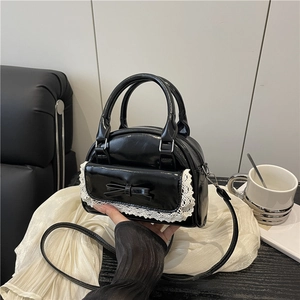 Black glossy bowling bag with white lace trim and bow detail for women fashion