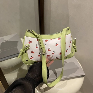 Cute cherry print shoulder bag for women with green leather trim and bow details