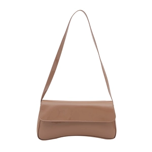 Glossy patent leather baguette shoulder bag in nude beige with sleek curved bottom