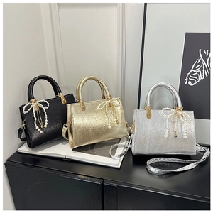 Chic square crossbody bags in gold, silver, and black with elegant pearl bow charms