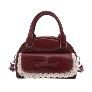 Burgundy faux leather dumpling handbag with bow and white lace trim in vintage style