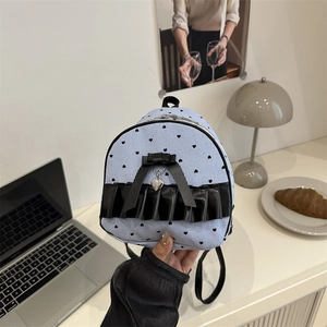 Mini bow backpack with heart patterns and black lace trim in light blue stripe finish