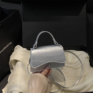 Silver crocodile pattern mini handbag with thin shoulder strap for crossbody wear
