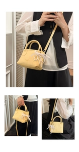 Detail view of yellow lychee leather mini bag with pearl lace bow and detachable strap