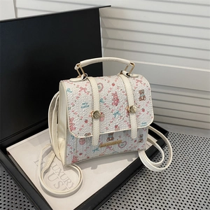 Cream floral backpack with cute bear and rabbit patterns and gold hardware details