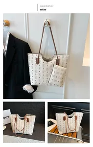 Detail of white tote bag with bear print, including matching small pouch and brown strap