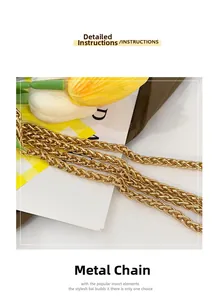 Detail of a chic golden braided metal chain strap for stylish bucket handbags