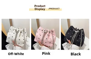Pleated shoulder bags in beige, pink, and black with bow embroidery and pearl charms