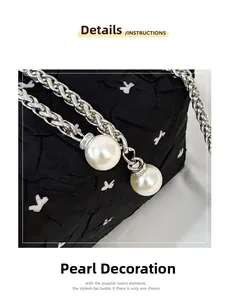 Detail of silver woven chain strap featuring elegant white pearl bead decorations