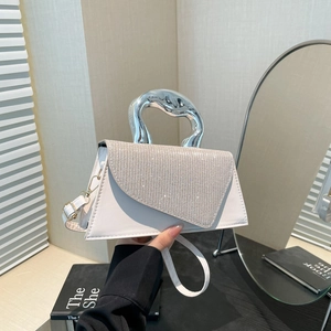 Elegant off-white structured handbag with silver rhinestone flap and metal handle