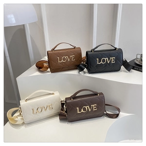 Detailed display of four quilted cylinder bags in brown, black, white, and coffee colors