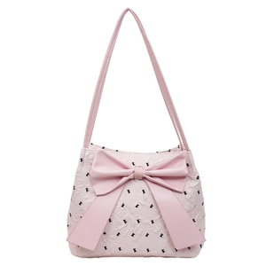 Pink seersucker shoulder bag with oversized bow and black polka dots for women
