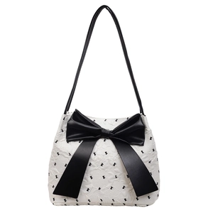 Minimalist black and white bow shoulder bag with bow embroidery and textured fabric