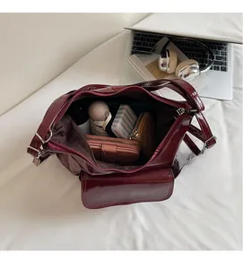 Interior view of deep red tote bag showing large capacity for umbrella and wallet