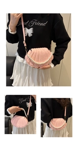 Pink shell-shaped crossbody bag with pearl chain decoration and textured faux leather