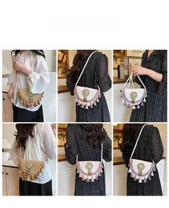 Detailed close-up of Bohemian woven straw crossbody bags with colorful tassels and patterns