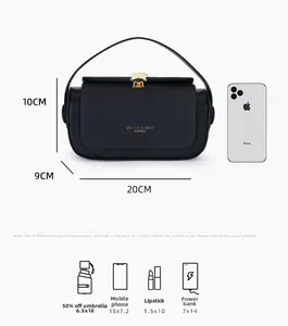 Detailed size comparison of luxury black handbag with an iPhone for scale reference