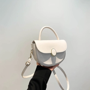 Retro white saddle bag with golden metal buckle and shoulder strap in high-quality leather